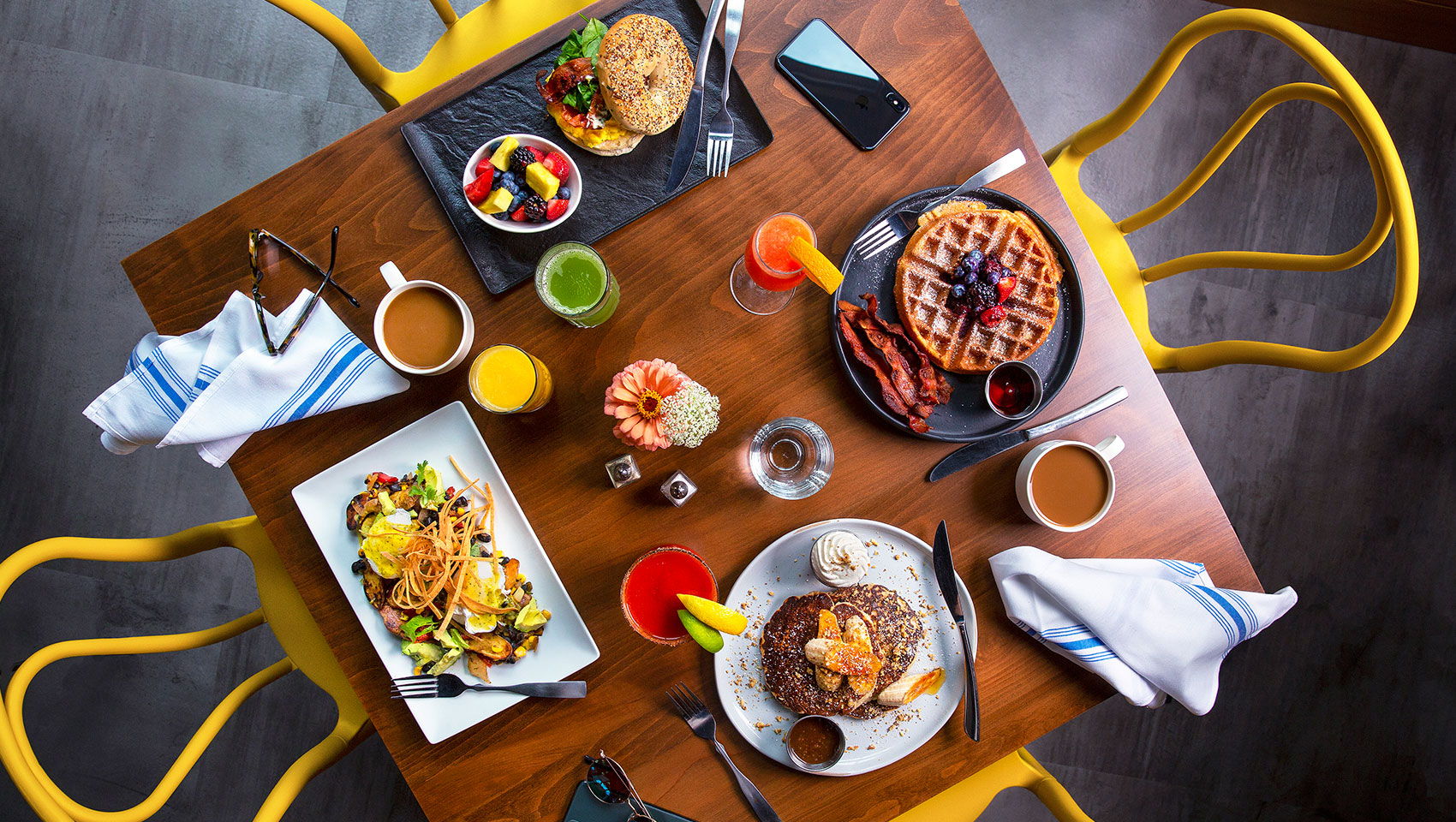 brunch table with various plated entrées being displayed