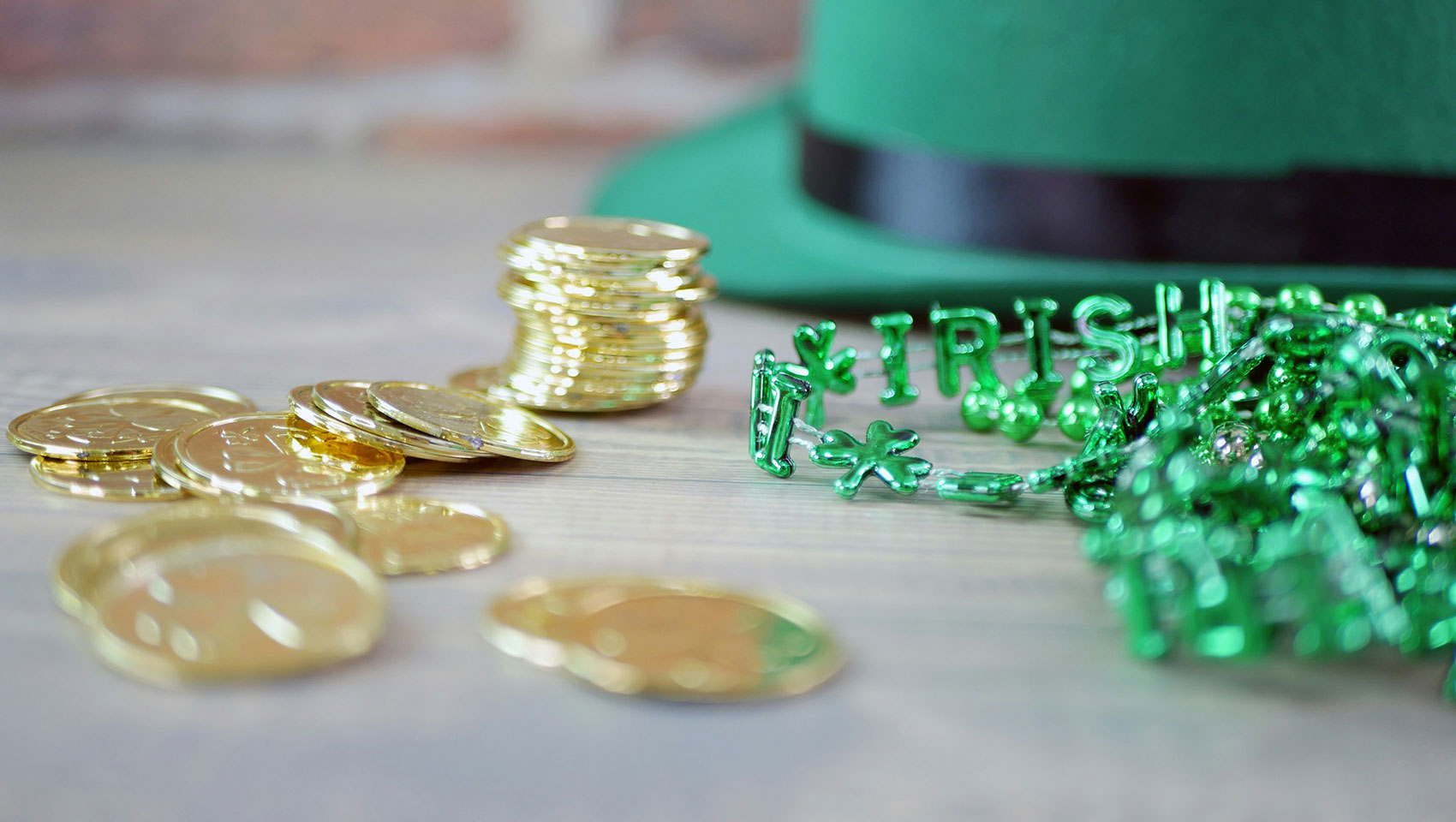 Gold coins, green hat and bead necklace